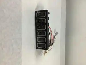 International 3549776C5 rocker switch cradle from 2015 International Lonestar, used